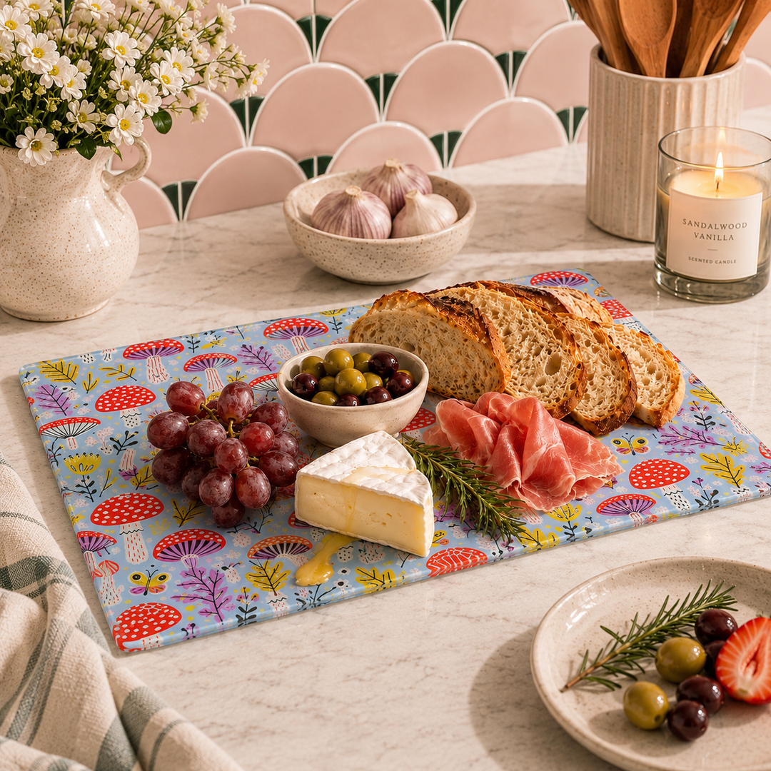 Mushroom design glass chopping board used as a charcuterie board with cheese and cured meats
