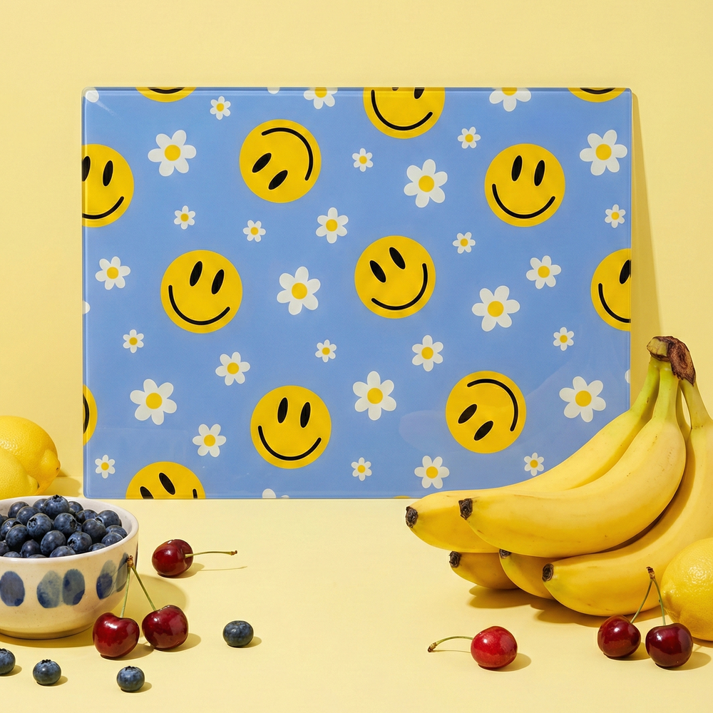 Blue happy face flower glass chopping board by Yililo, a colourful toughened glass worktop saver