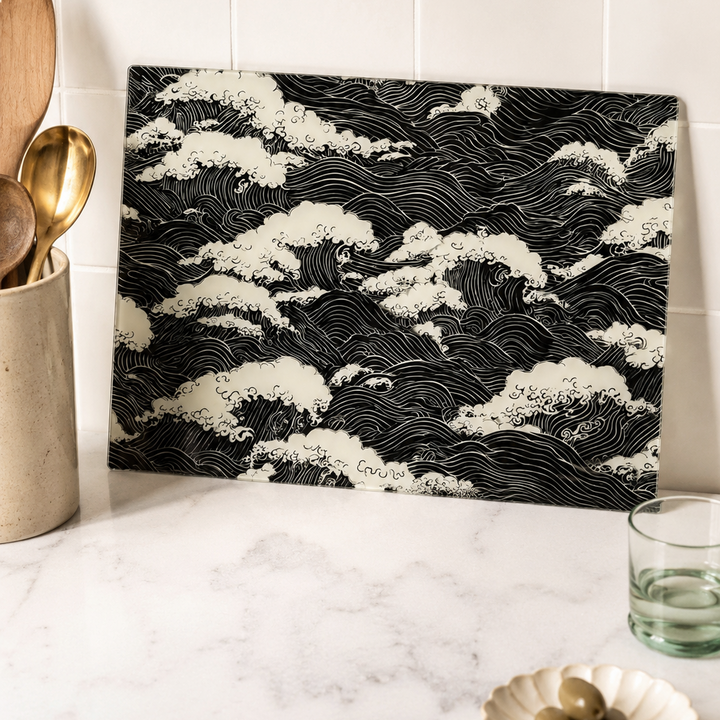 Black and white wave pattern cutting board on a kitchen counter
