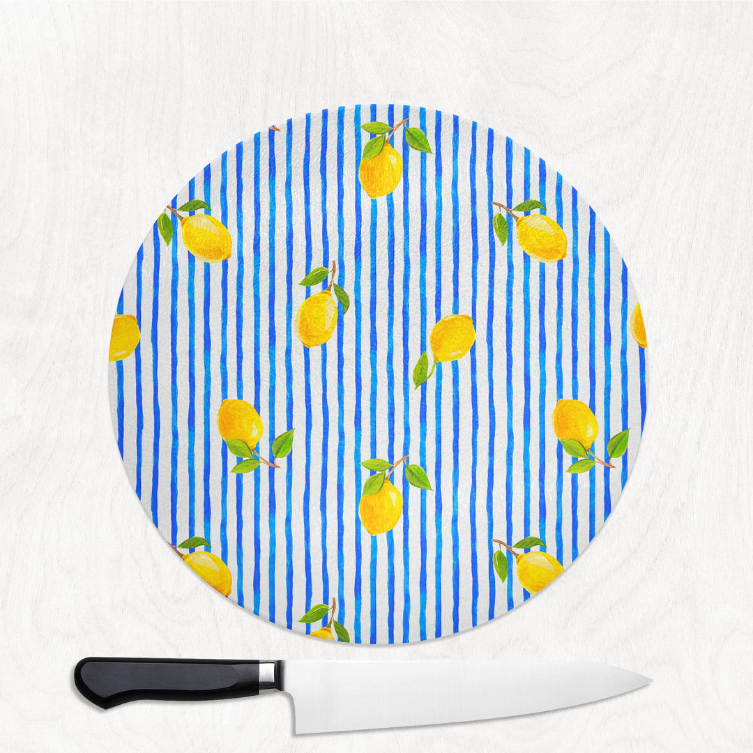 Round cutting board with pineapple pattern on a white background