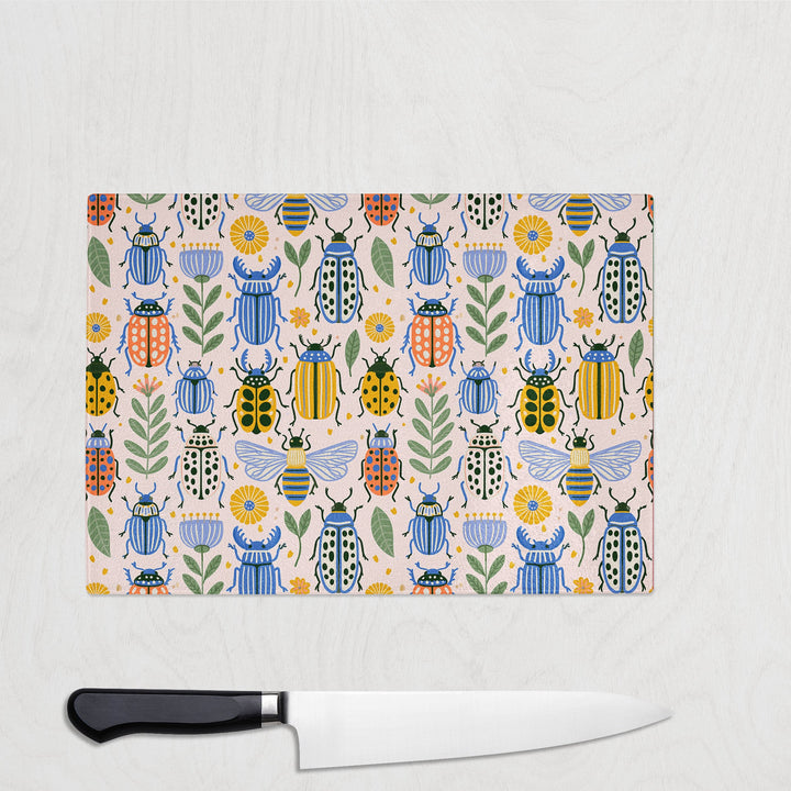Bugs in Colour glass chopping board with hand-painted beetles, bees and ladybirds