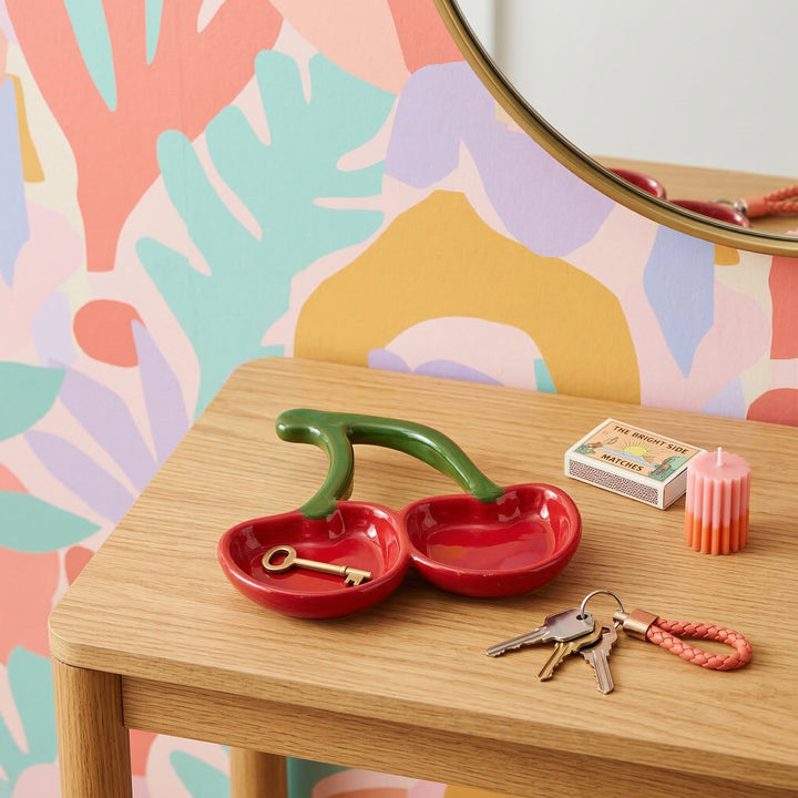 Cherry shaped trinket dish on a console table 