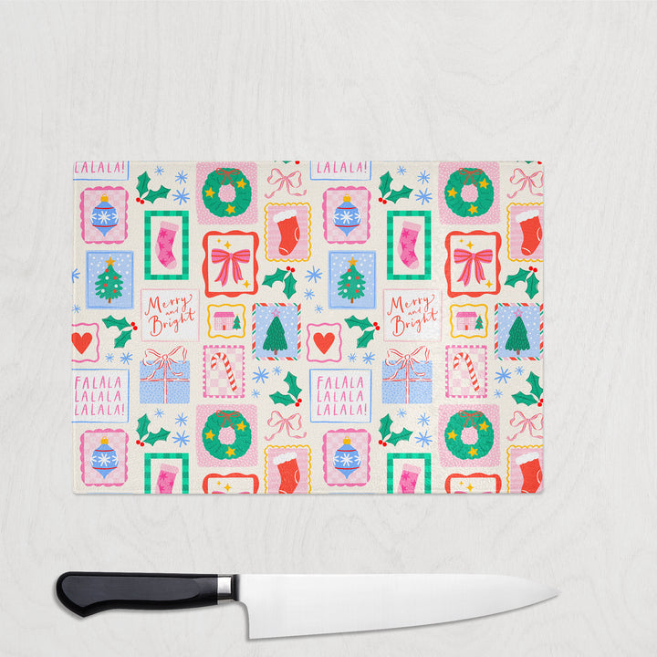 Christmas-themed cutting board with decorative patterns on a white surface.