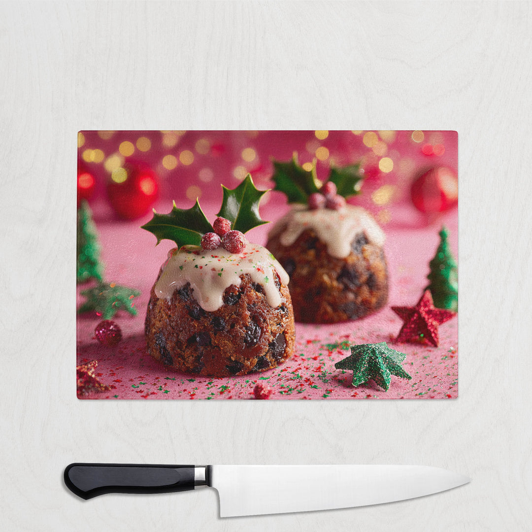 Christmas pudding with holly on a chopping board with a knife in front