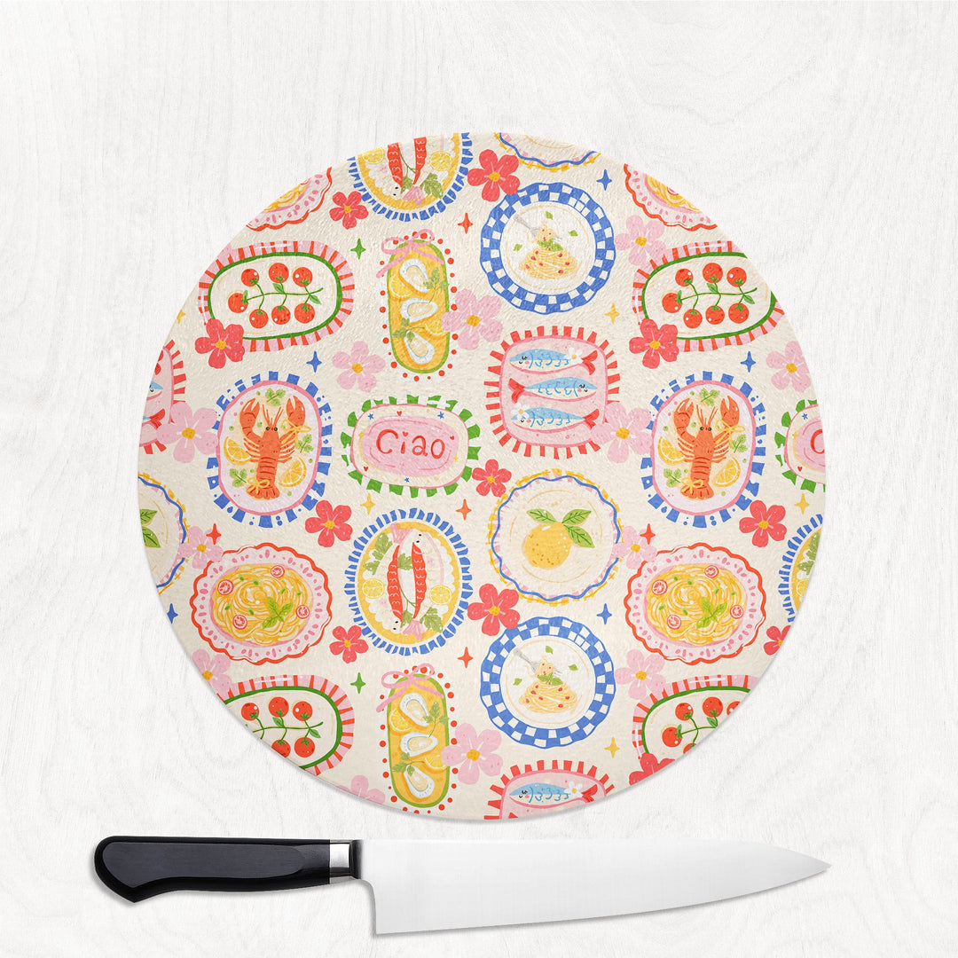 Ciao Summer round glass chopping board with pasta, lemons, lobster and pretty plates