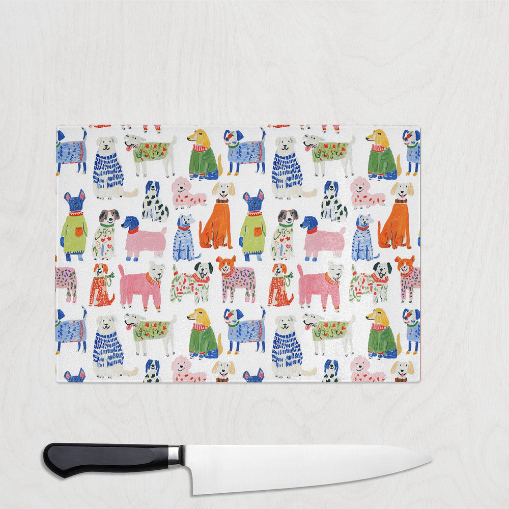 Colourful Dog glass chopping board with a pack of painterly colourful dogs
