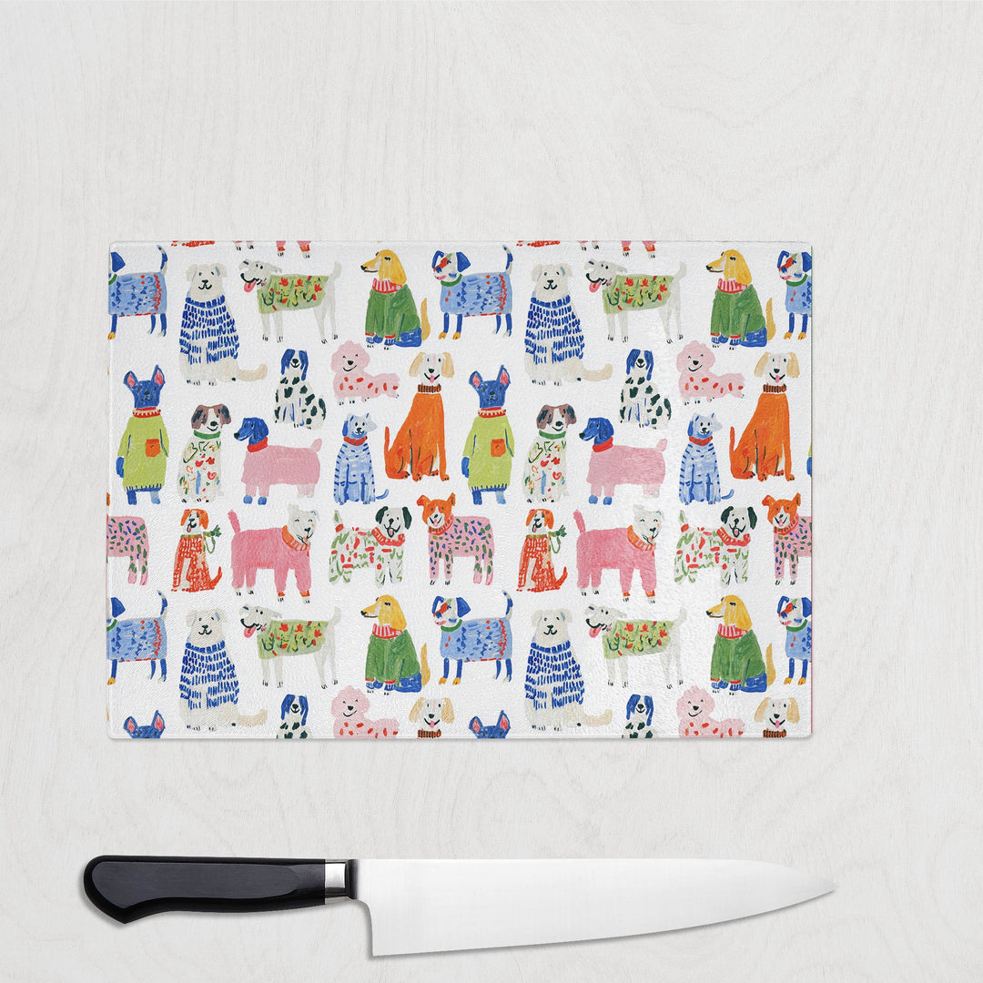 Colourful Dog glass chopping board with a pack of painterly colourful dogs