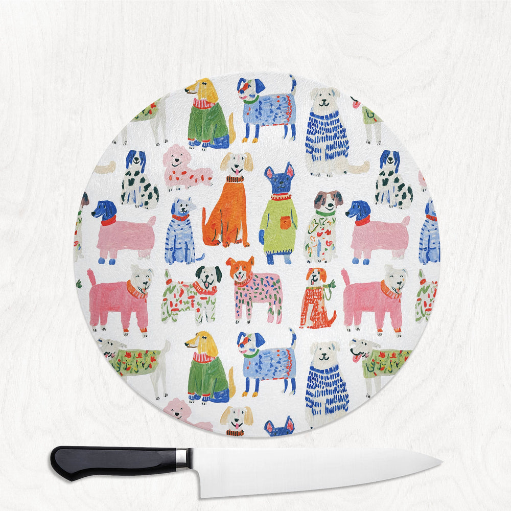 Colourful Dog round glass chopping board with a pack of painterly colourful dogs
