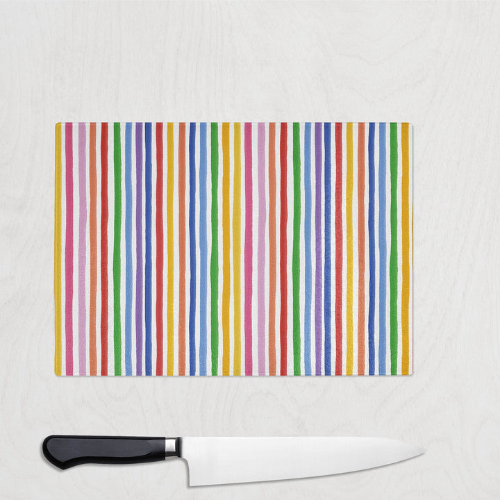 Colourful Stripes glass chopping board with bold hand-painted rainbow stripes