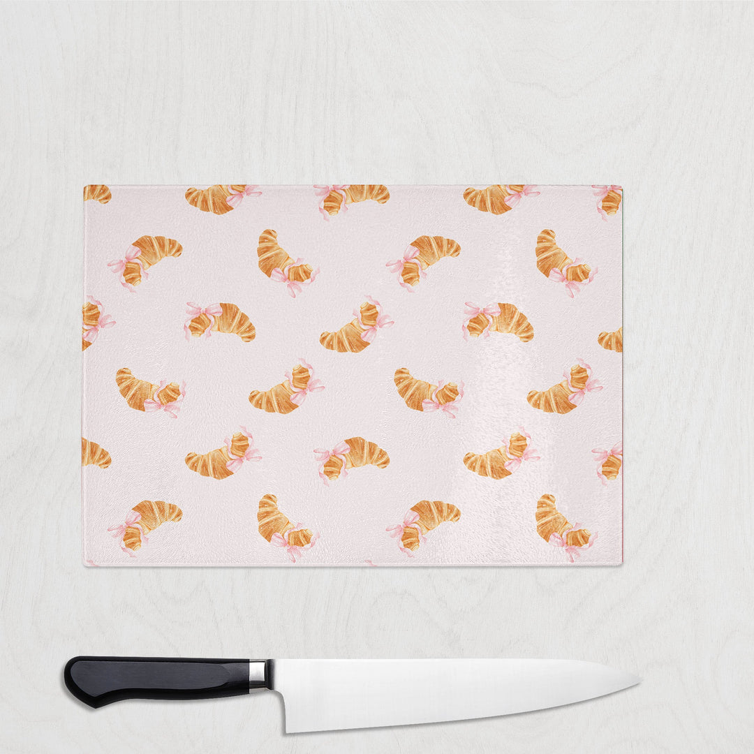 Cute Croissant glass chopping board with buttery croissants tied with pink bows