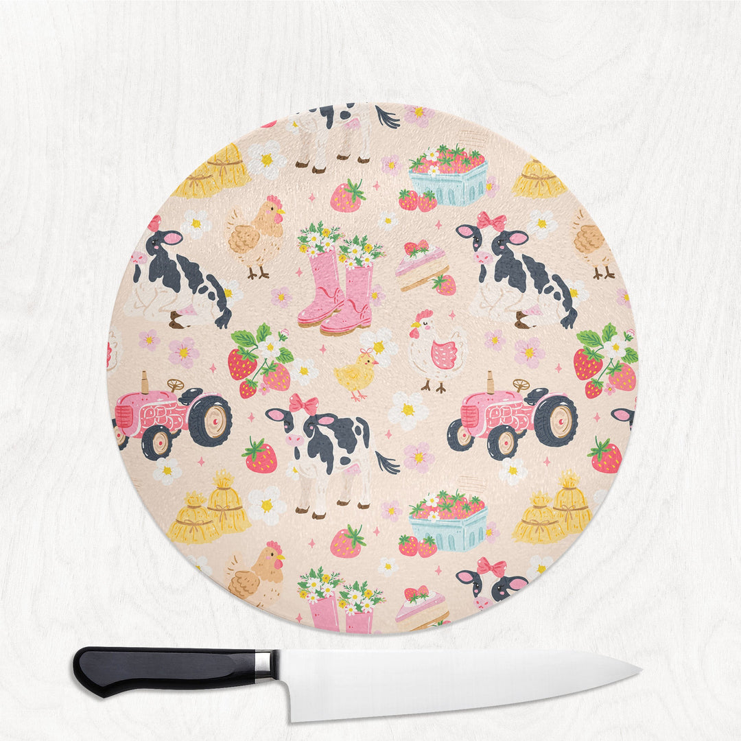 Cute Farmyard Life round glass chopping board with cows, chickens, tractors and strawberries