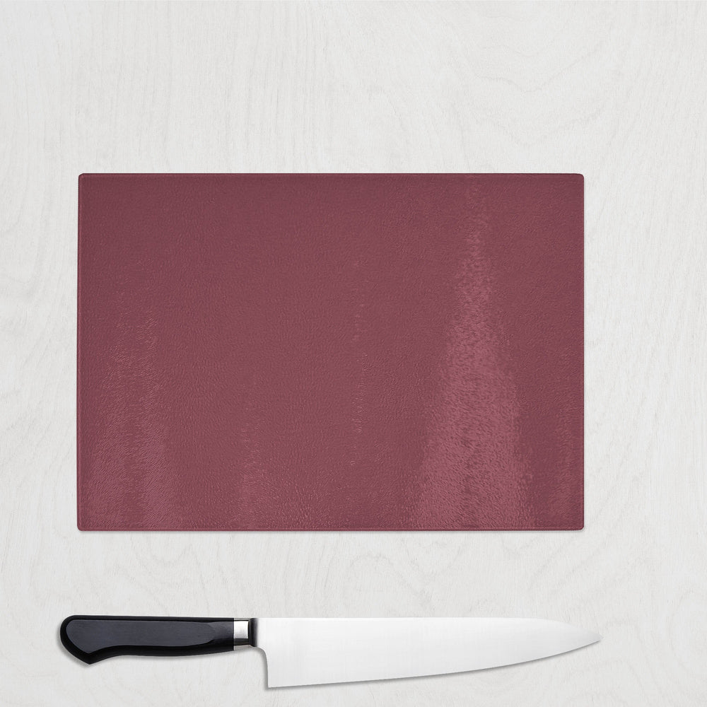 Burgundy Wine cutting board with a knife on a light gray background
