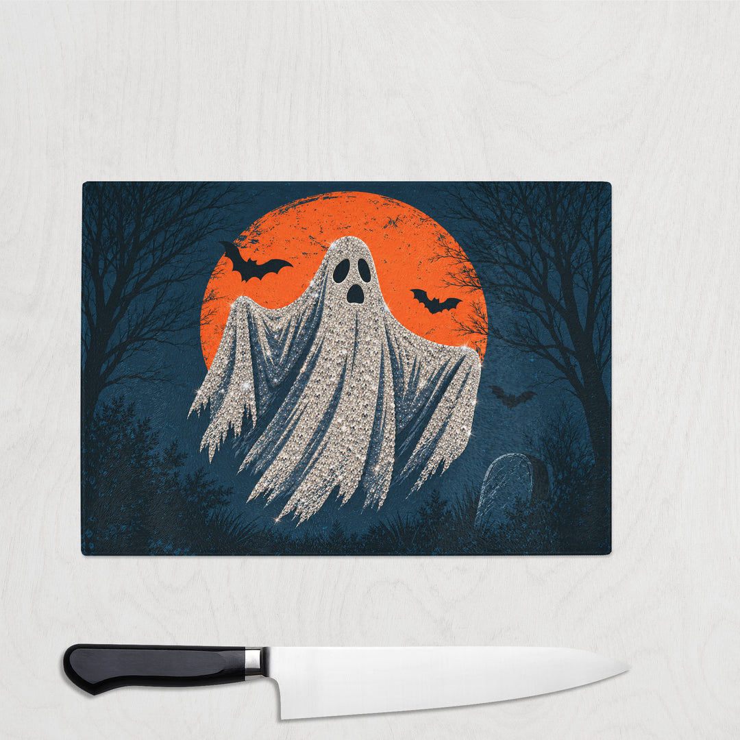 Diamante Ghost glass chopping board with a sparkling sheet ghost floating in front of an orange moon