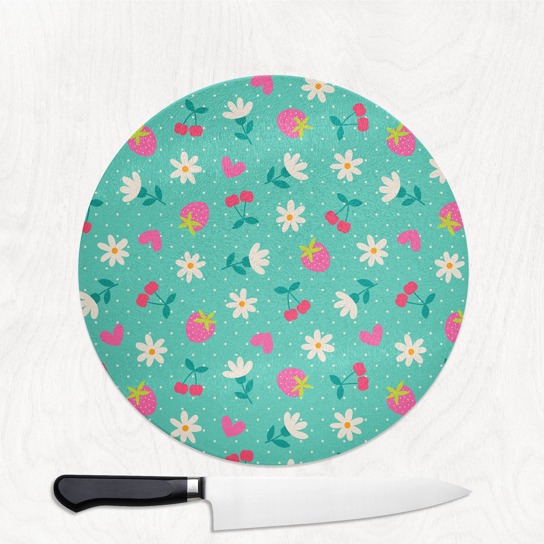 Round cutting board with floral pattern on a white background