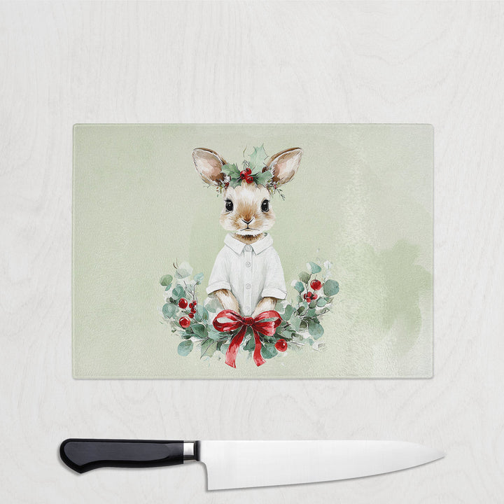Decorative cutting board with a rabbit illustration and knife on a light background