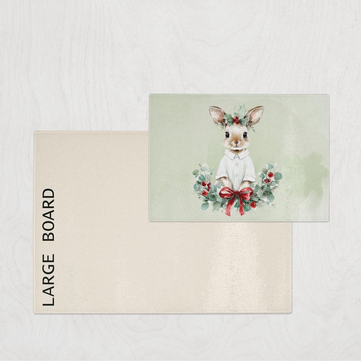 Large board with a decorative card featuring a deer and floral wreath on a light gray background.
