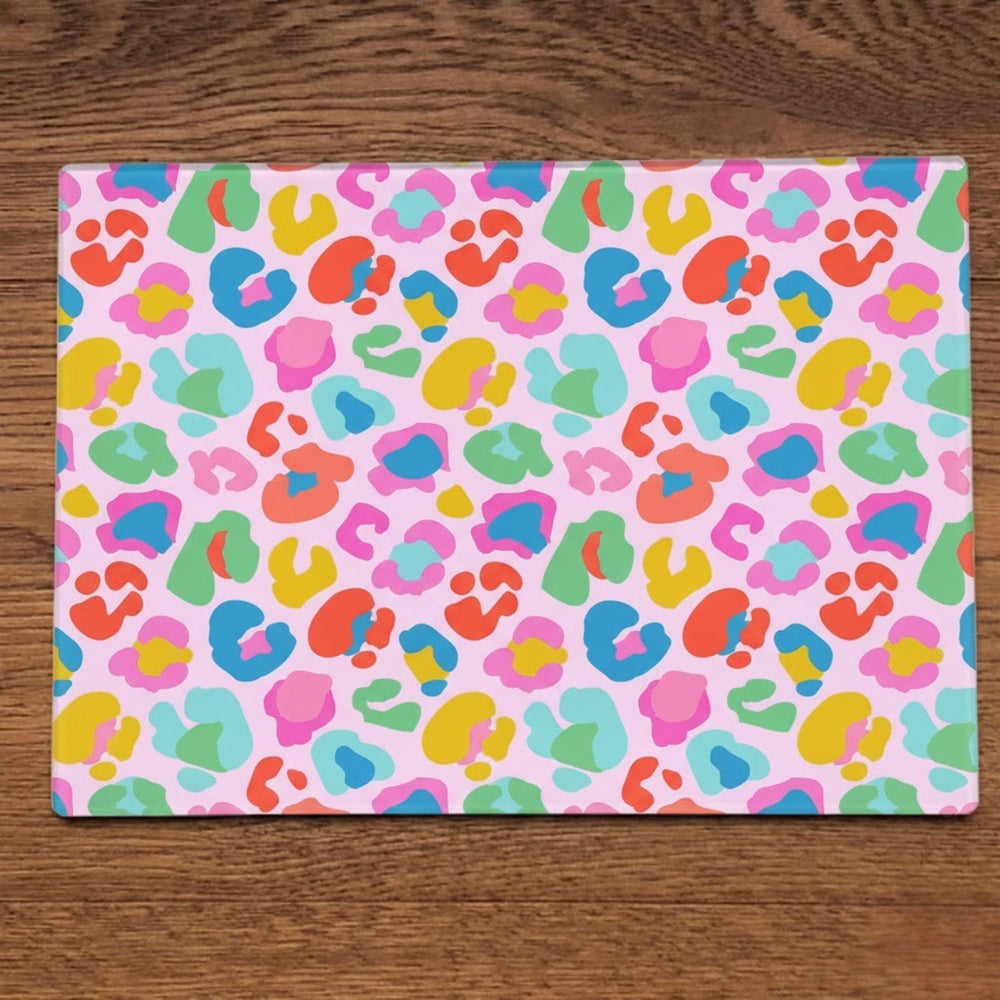Wild rainbow leopard print glass placemats by Yililo, a colourful wipe clean table setting