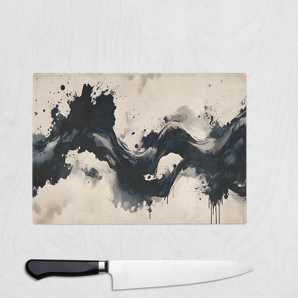 Midnight Flow abstract glass chopping board with black ink wave design on beige background