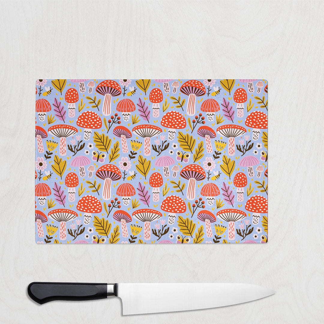 Mushroom Magic glass chopping board with toadstools, leaves, bees and butterflies