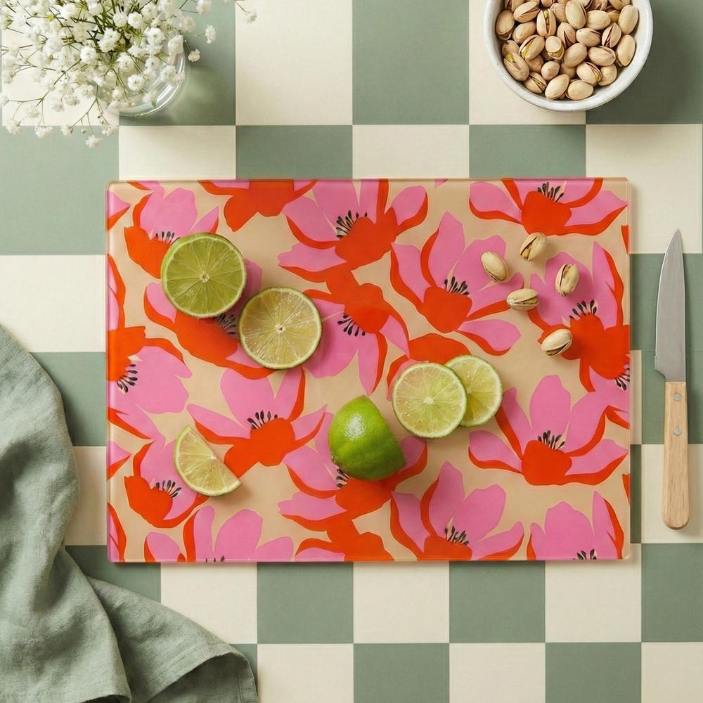 Pink colourful floral chopping board with cut limes and a chequered background 