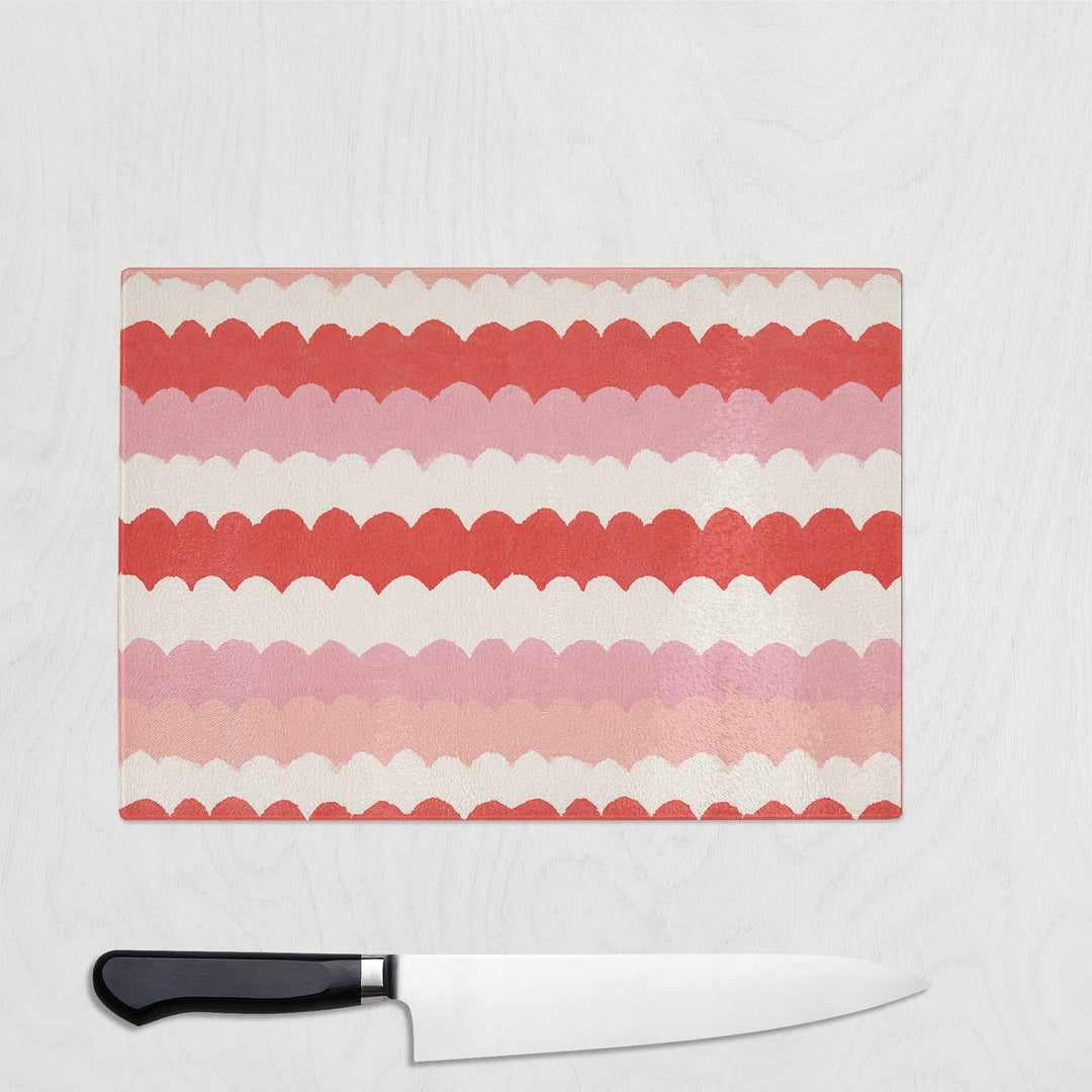 Pink Scallop Wave glass chopping board with soft scalloped waves of pink and coral
