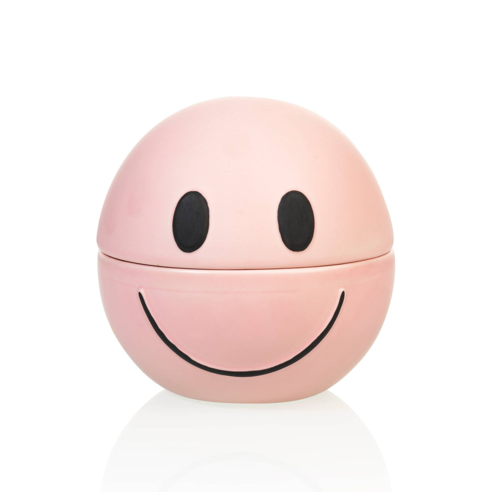 Pink smiley face-shaped container on a white background