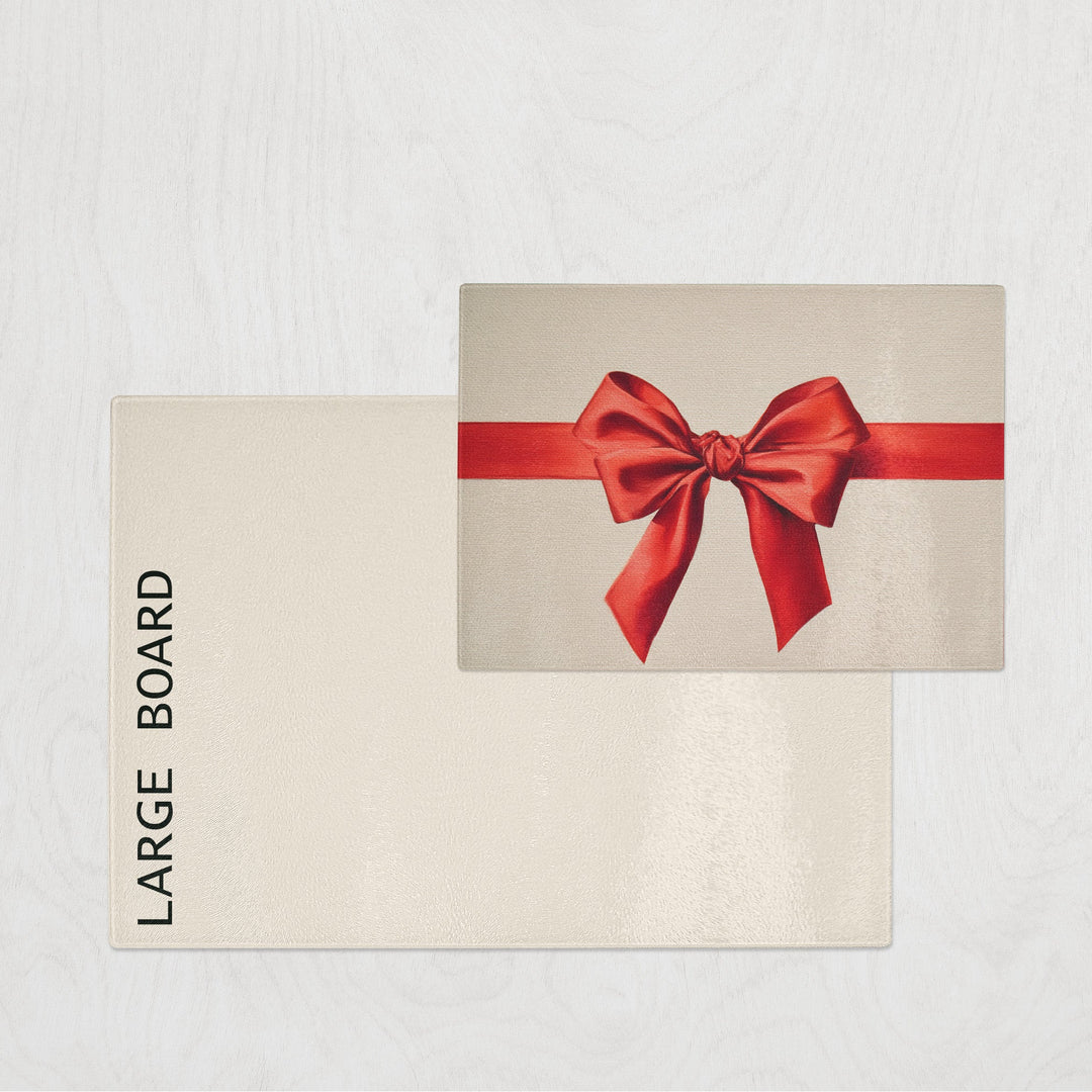 Beige chopping board with a red bow on a light gray background