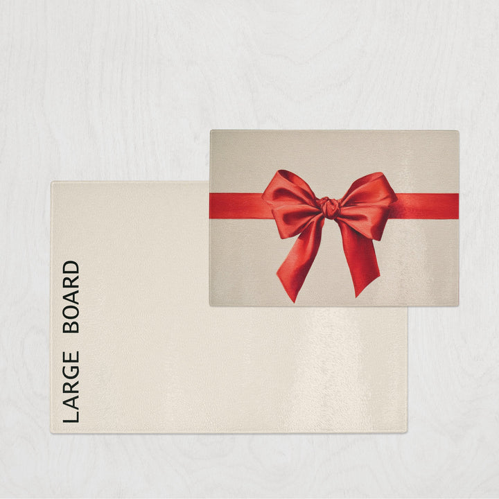 Beige chopping board with a red bow on a light gray background