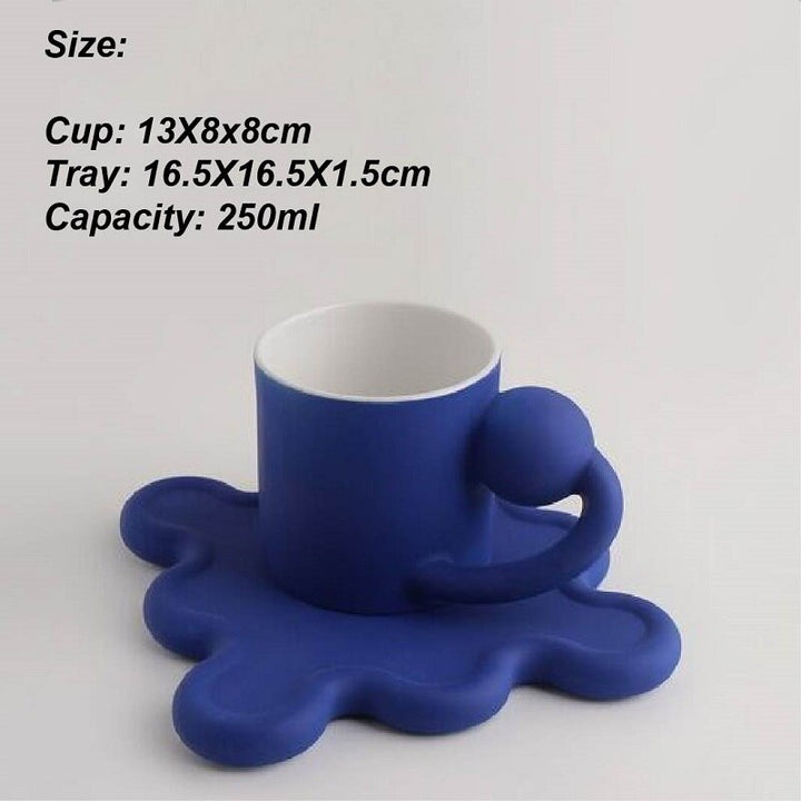 Chrome Coffee Mug With Rotating Ball Handle And Swirly Silver Saucer For Cup