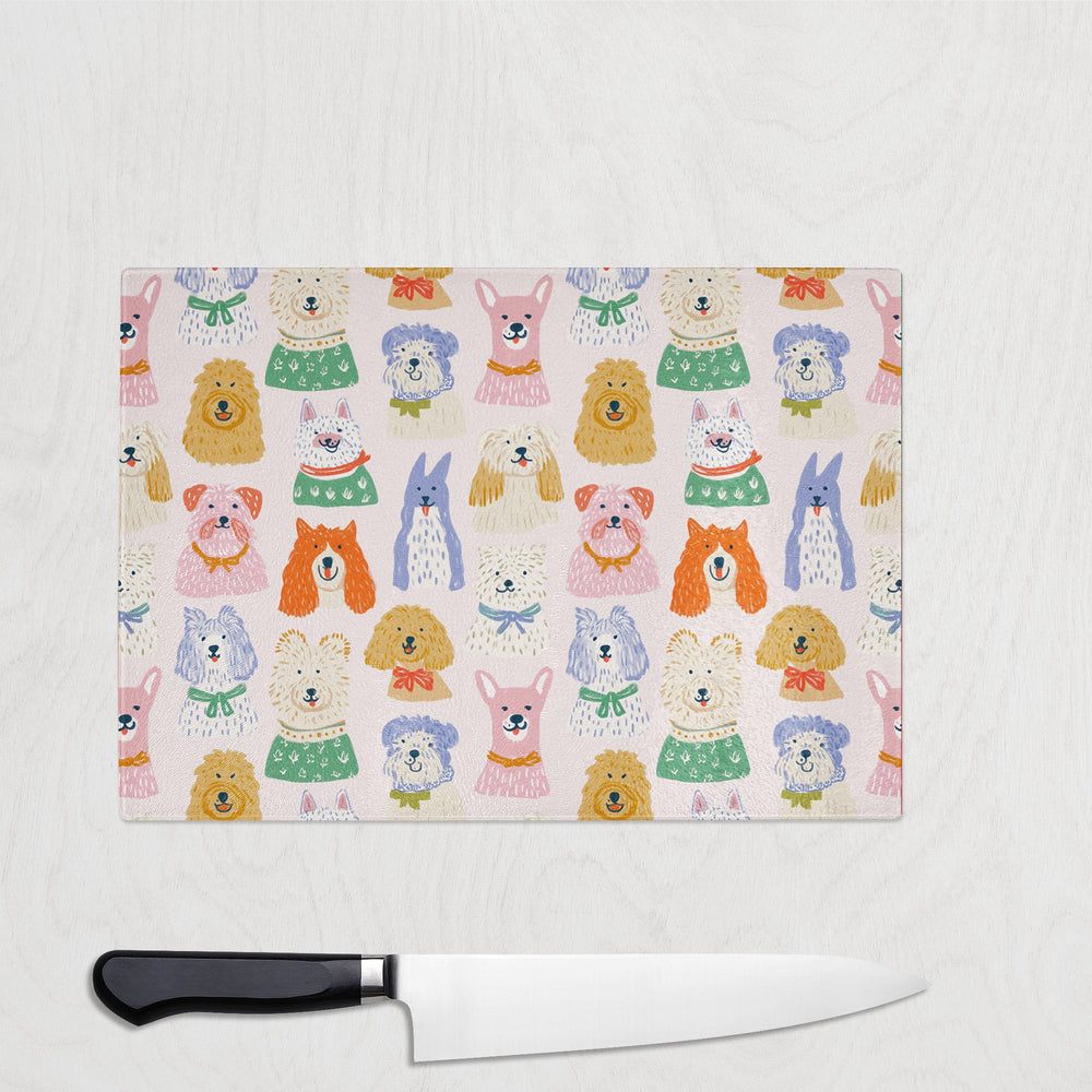 Smiling Colourful Dogs glass chopping board with a happy crowd of painterly dogs