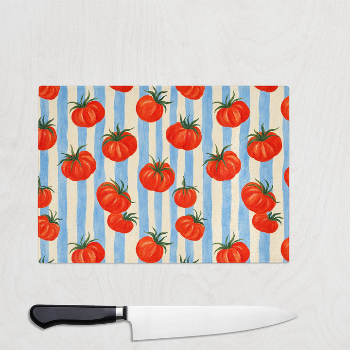Tomato and Stripes glass chopping board with plump tomatoes on blue and cream stripes