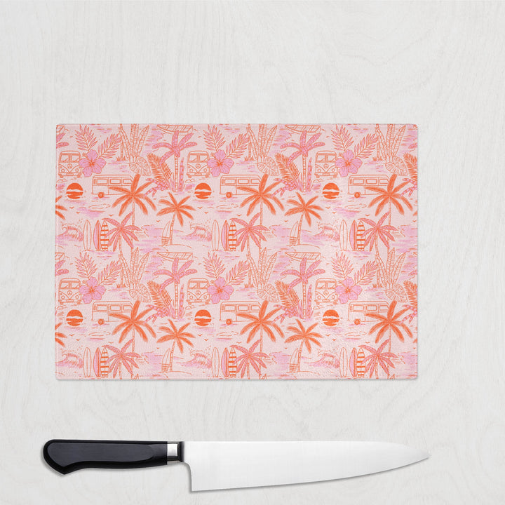 Tropic Cabana Cool glass chopping board with retro palm tree beach print in pink and orange