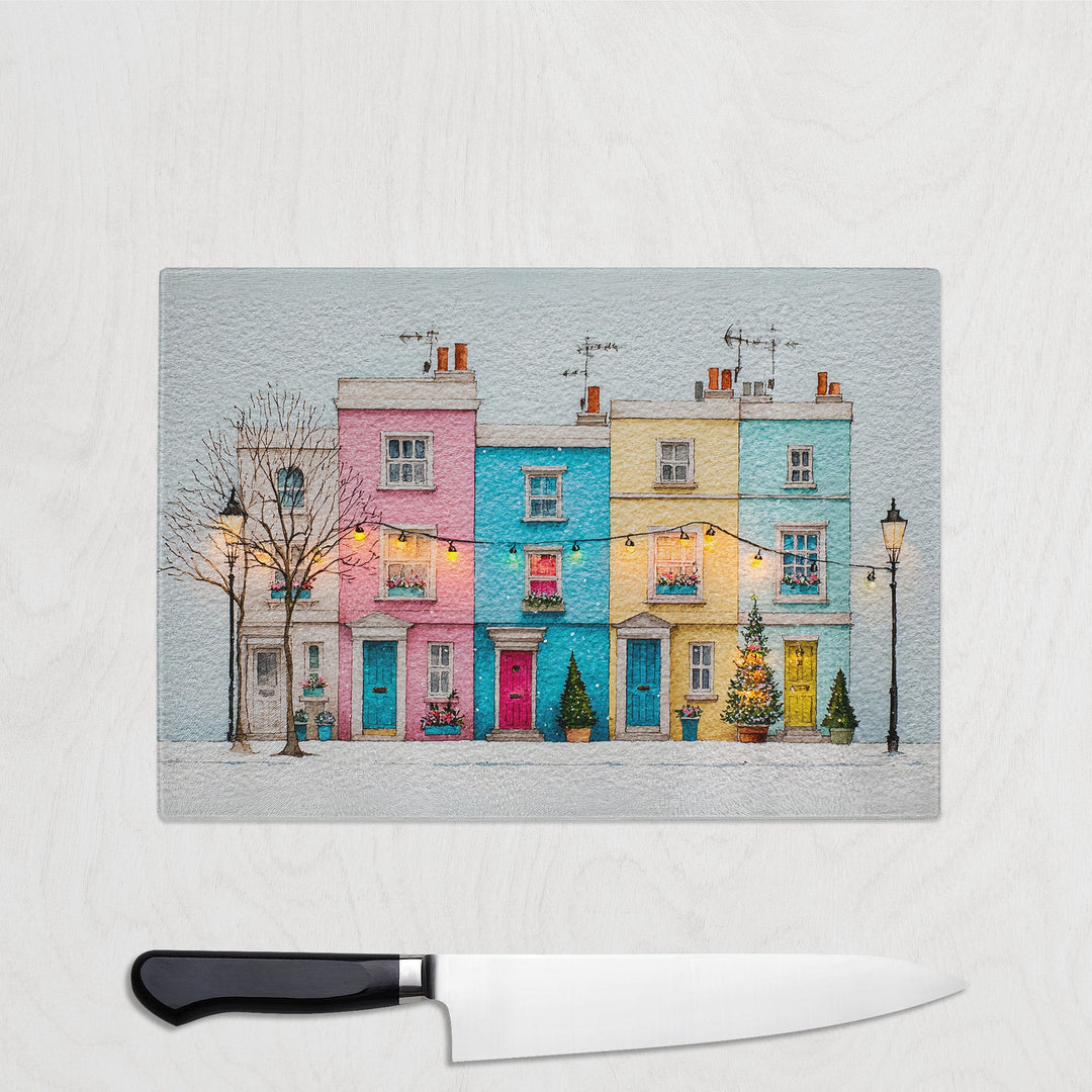 Colorful row of houses on a glass panel with a knife below