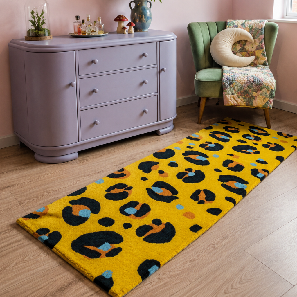 Room interior with a purple dresser, green chair, and yellow leopard print rug.