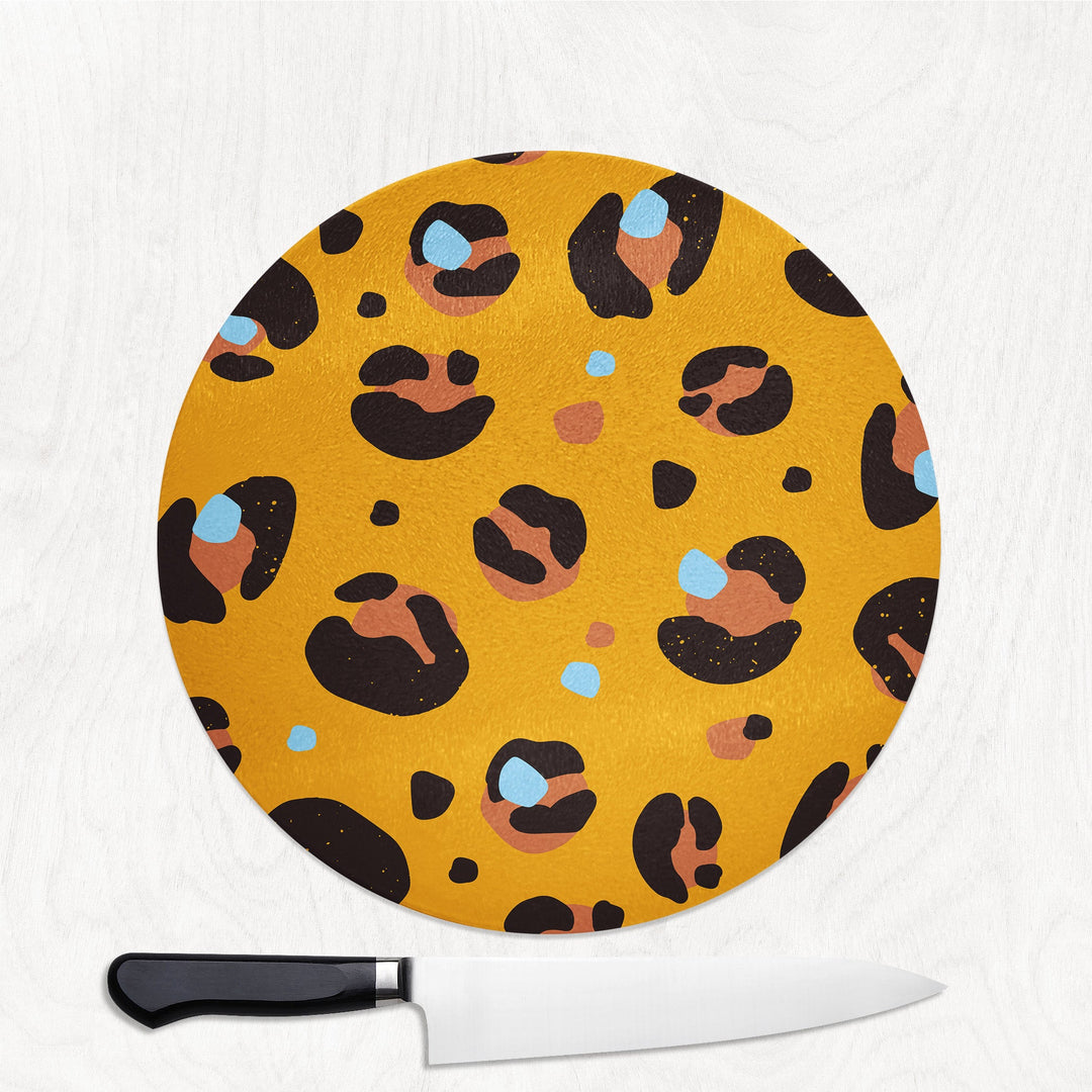Round cutting board with leopard print design on a white background