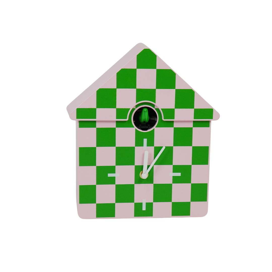 Checkered cuckoo clock with green and pink pattern on a white background
