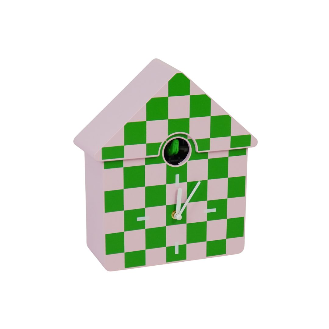 Checkered cuckoo clock with green and pink pattern on a white background