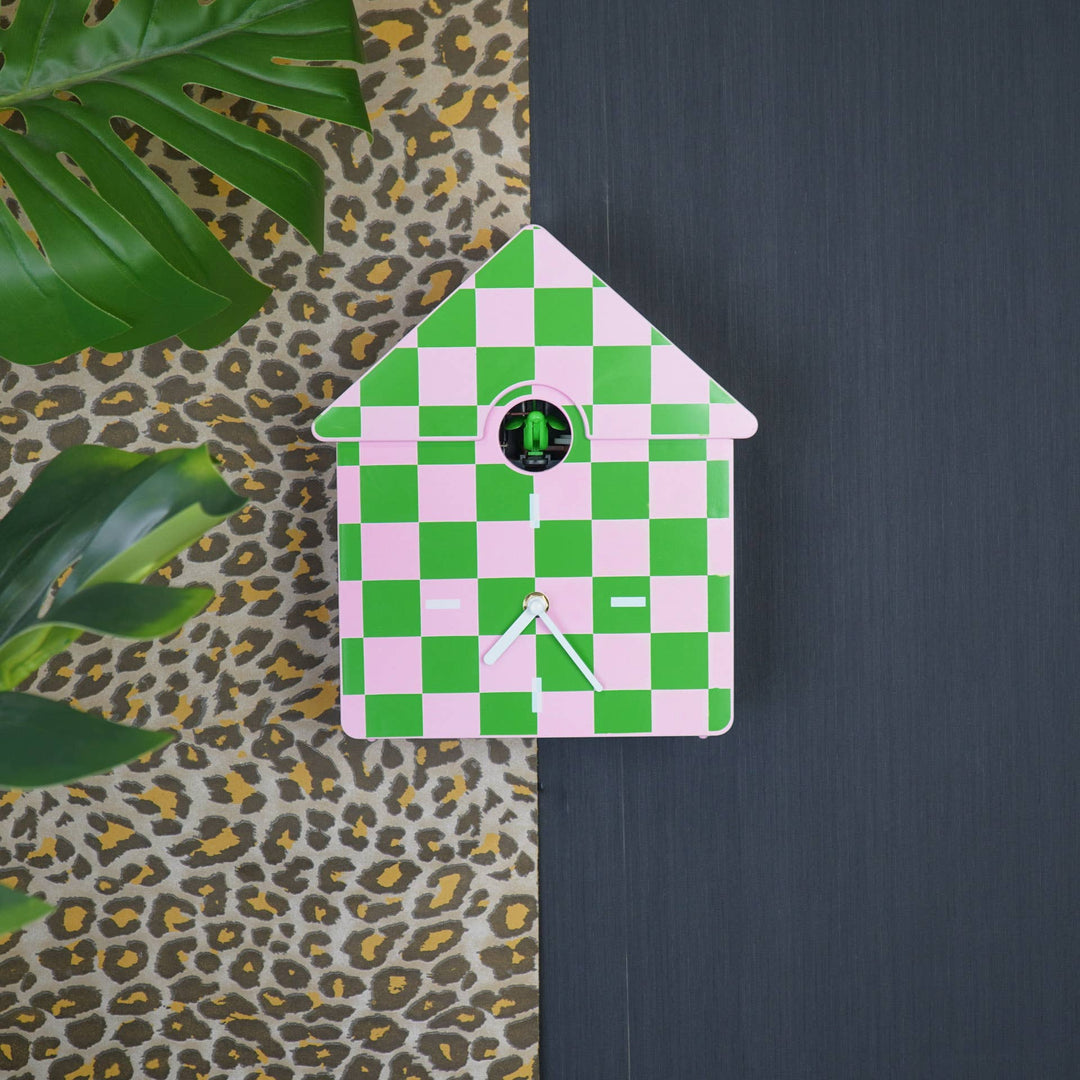 Modern pink and green checkerboard cuckoo clock with white hands