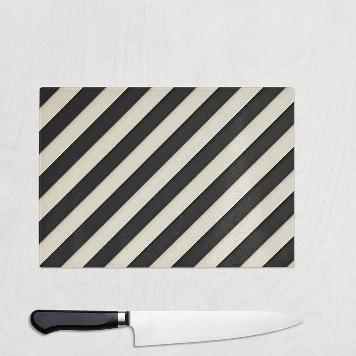 Black and cream diagonal striped glass chopping board called Parallel Noir