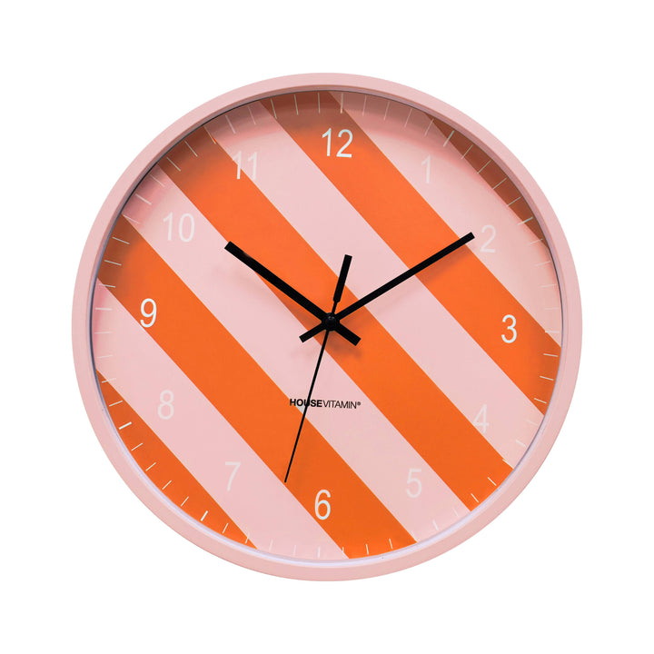 Pink and orange striped wall clock with black hands and round pink frame