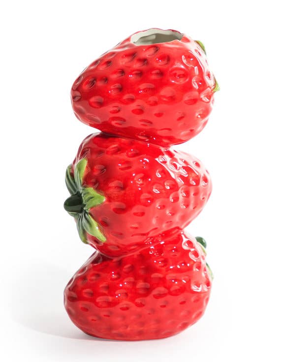 Stack of red strawberry-shaped objects on a white background