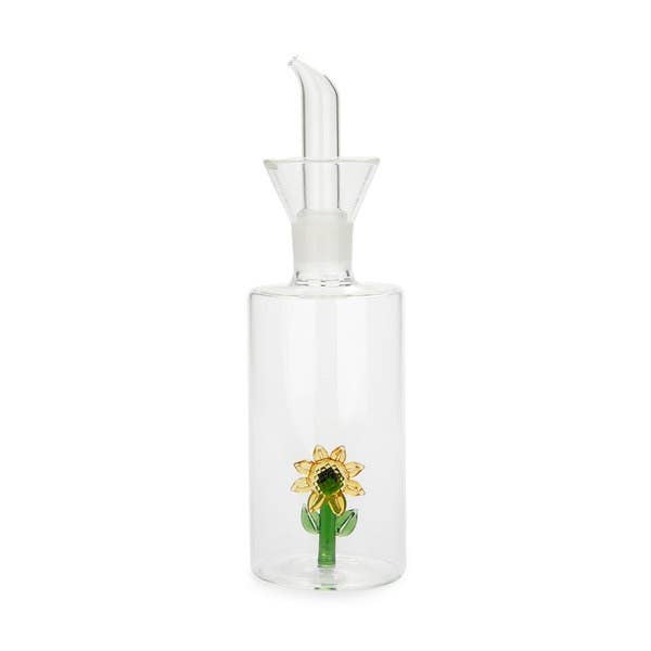 Clear glass bottle with sunflower design on a white background