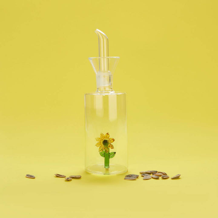 Clear borosilicate glass oil bottle with sunflower detail and drip-free spout