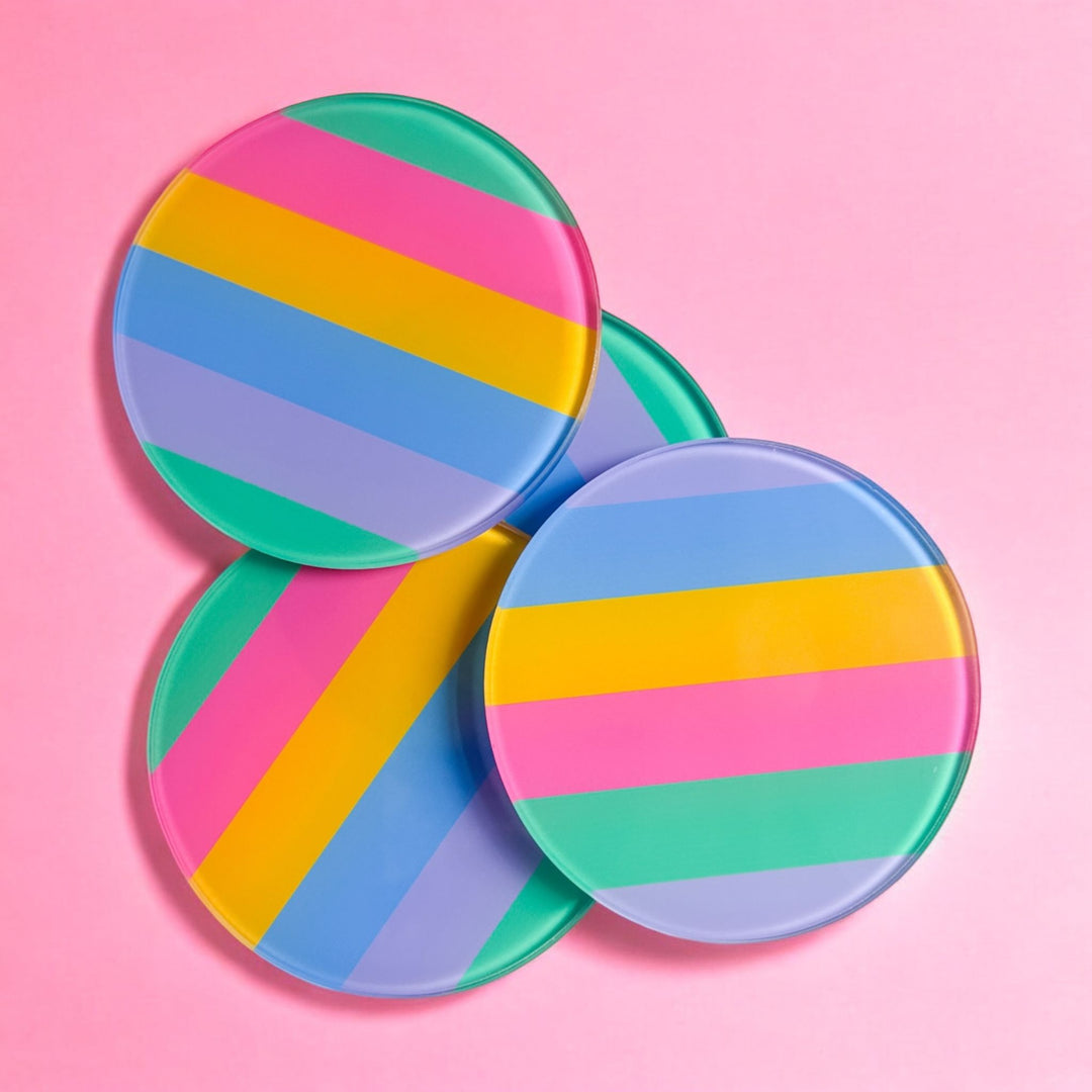 Bright Colour Stripe 4 piece glass coaster set, round glass coasters with colourful diagonal stripes in pink, yellow, green, blue and purple