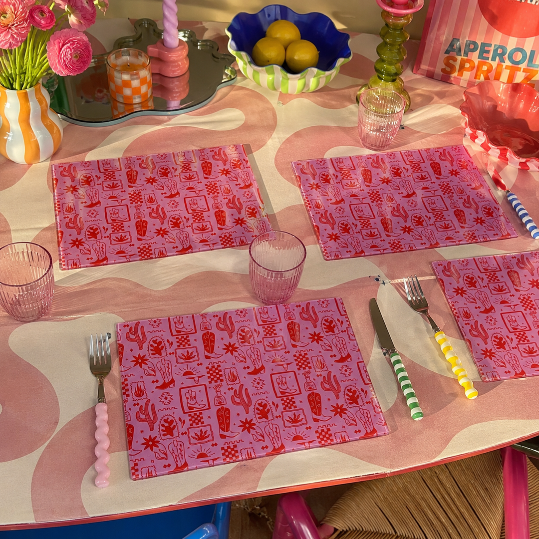 Yililo Cowgirl Rodeo Pink glass placemats, printed with a pink western rodeo design.
