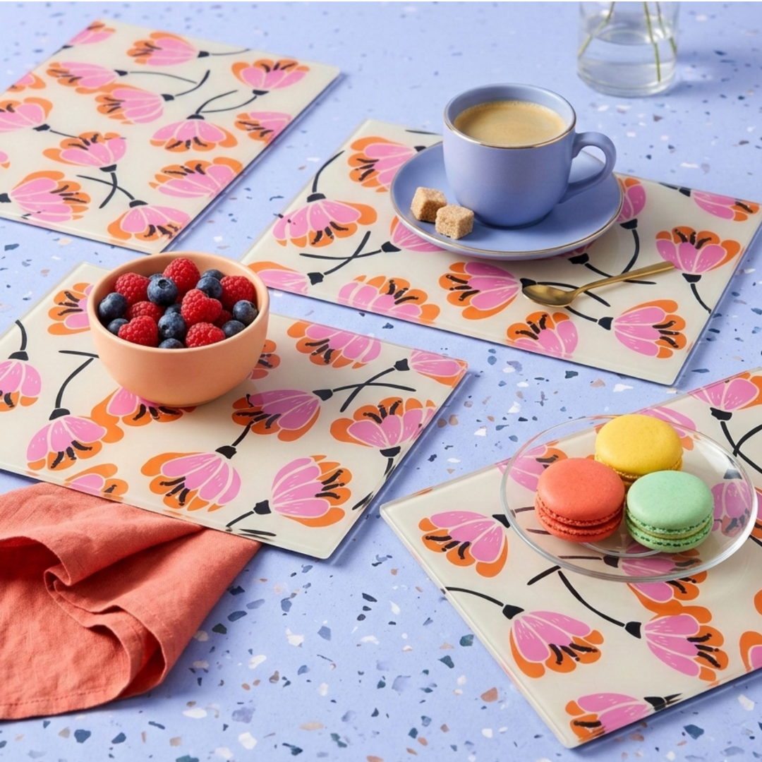Yililo Retro Bloom glass placemats, printed with a bold retro floral design.