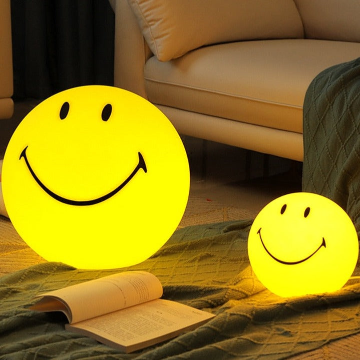 Gelbe Tischleuchte mit Smiley-Gesicht
